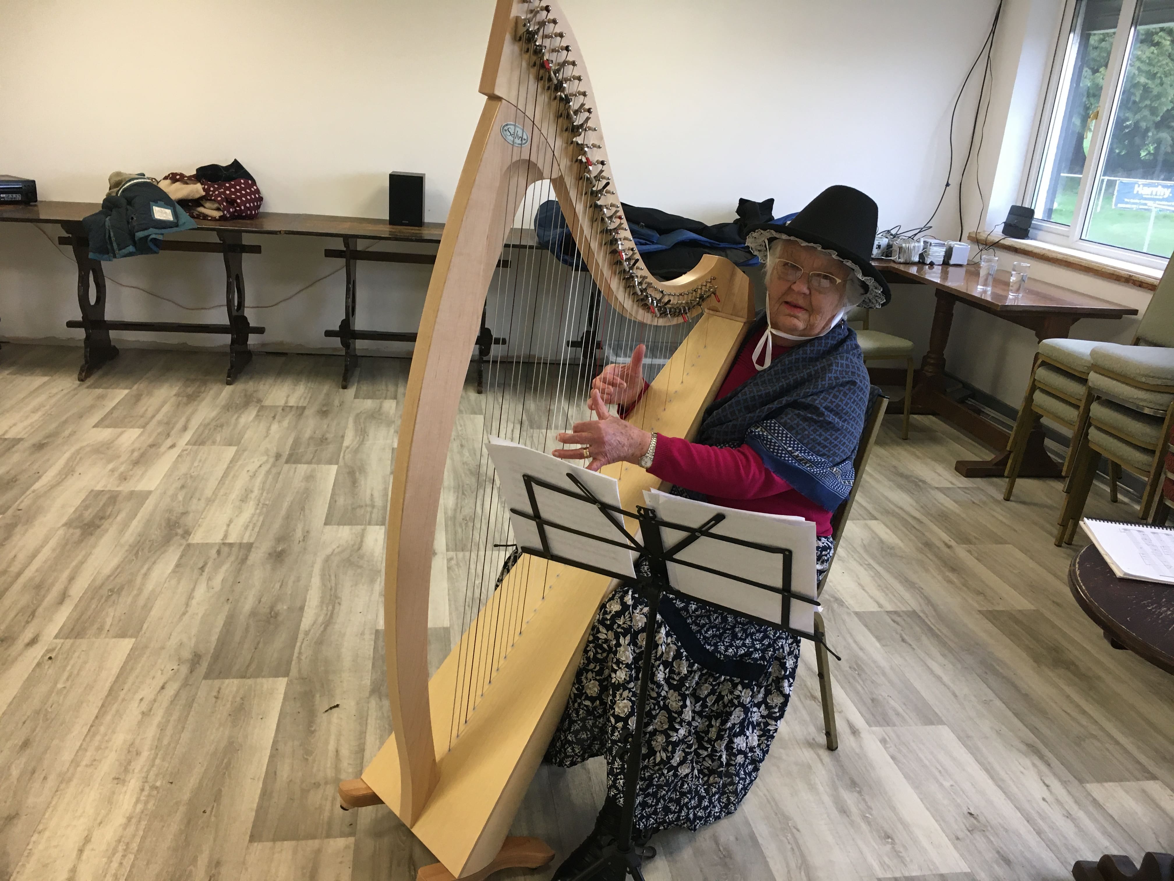 Pamela plays the harp