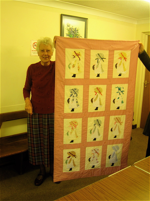 Sheila Mepham with hand sewn quilt