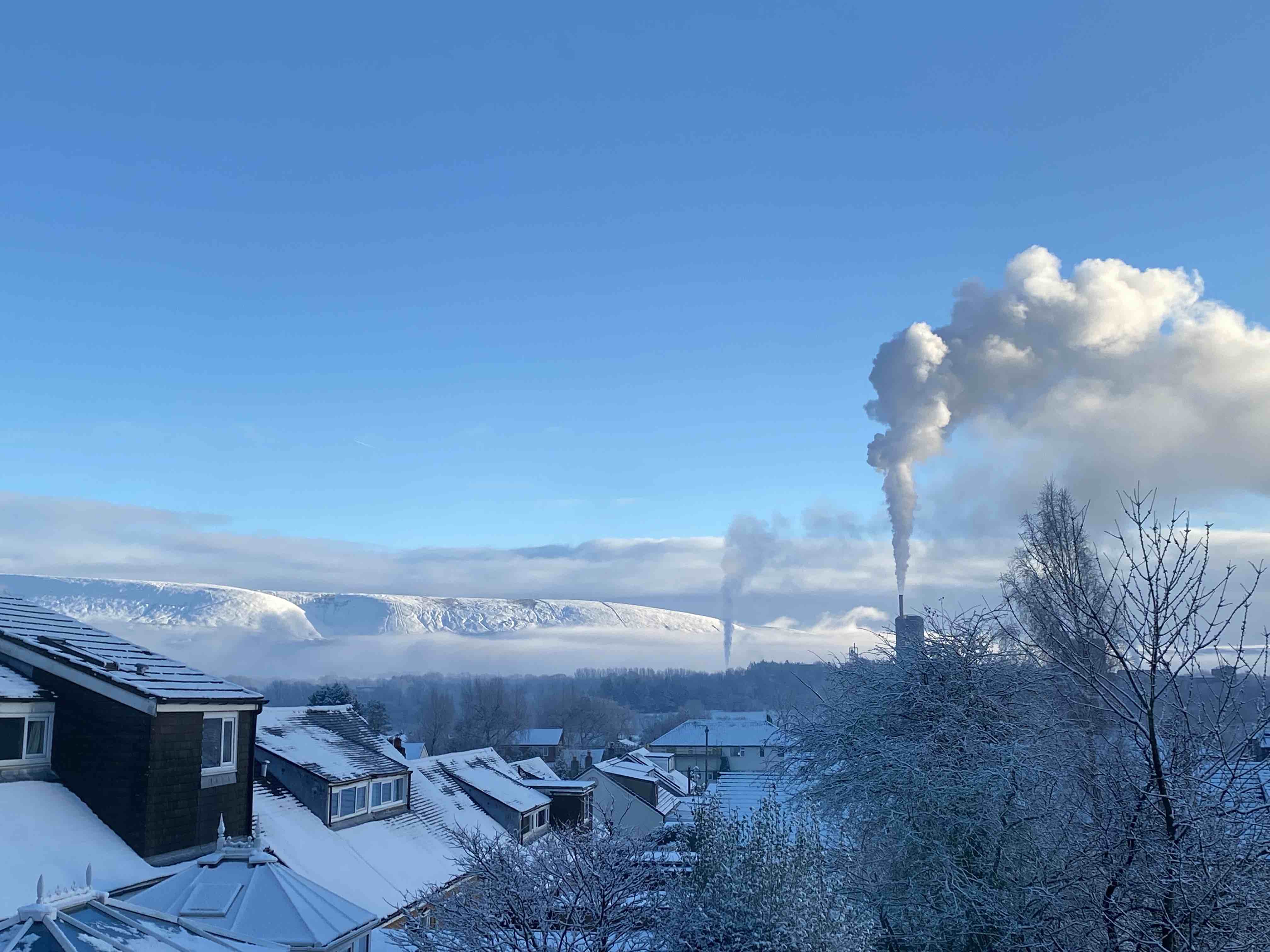 Snow over Pendle with Smoke Trails