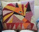 Embroidered cat cushion